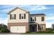 Two-story home featuring brick and vinyl siding with a two-car garage at 8225 Coldstream Dr, Fairburn, GA 30213