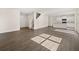 Open-concept living room featuring hardwood floors, stairs and an eat-in kitchen at 8225 Coldstream Dr, Fairburn, GA 30213