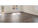 Spacious living room with hardwood floors and natural lighting at 8225 Coldstream Dr, Fairburn, GA 30213