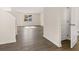 Spacious living room with beautiful wood flooring and natural light at 8225 Coldstream Dr, Fairburn, GA 30213