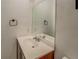 Bathroom features modern sink, vanity, and framed mirror at 115 Plantation Dr, Clarkston, GA 30021