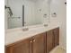 Bathroom features double sinks with framed mirrors at 115 Plantation Dr, Clarkston, GA 30021
