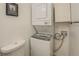 Laundry Room featuring stacked washer and dryer and toilet at 115 Plantation Dr, Clarkston, GA 30021
