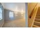 Spacious living room with neutral carpet, decorative wall sconces, and crown molding at 115 Plantation Dr, Clarkston, GA 30021