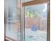 View from inside, of the small brick patio with brick privacy fence at 115 Plantation Dr, Clarkston, GA 30021