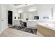 Bright bathroom featuring dual sinks, vanity area, and soaking tub at 1286 Creekside Se Ter, Smyrna, GA 30082