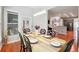 Light-filled dining room features hardwood floors and modern lighting fixture at 1286 Creekside Se Ter, Smyrna, GA 30082