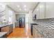 Modern kitchen with granite countertops, stainless steel appliances, and hardwood floors at 1286 Creekside Se Ter, Smyrna, GA 30082