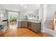 Bright kitchen featuring granite countertops, stainless steel appliances, and hardwood floors at 1286 Creekside Se Ter, Smyrna, GA 30082