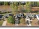 Aerial view of a residential neighborhood with homes bordering a lake, showcasing community and scenery at 150 Northshore Xing, Dallas, GA 30157
