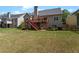 Spacious backyard with lush green grass and mature trees, offering ample room for recreation at 150 Northshore Xing, Dallas, GA 30157