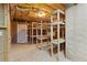 Unfinished basement storage space with open shelving, ready for customization and organization at 150 Northshore Xing, Dallas, GA 30157
