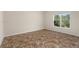 A spacious room in the basement featuring neutral paint, carpet flooring and a window at 150 Northshore Xing, Dallas, GA 30157