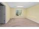 A bright basement room with carpeting, a drop ceiling and a view to the outside at 150 Northshore Xing, Dallas, GA 30157