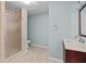 Bathroom featuring a stand-up shower with glass door, tile flooring, and vanity with sink at 150 Northshore Xing, Dallas, GA 30157