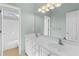 Bathroom with dual sinks, a large mirror, and a walk-in shower/tub combo at 150 Northshore Xing, Dallas, GA 30157