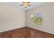 Bright bedroom with hardwood floors, ceiling fan, and view from the double window at 150 Northshore Xing, Dallas, GA 30157