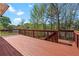 Large wooden deck with railing, offering plenty of space for outdoor furniture and gatherings at 150 Northshore Xing, Dallas, GA 30157