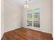 Bright dining room with hardwood floors and a large window at 150 Northshore Xing, Dallas, GA 30157