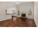 Spacious living room with hardwood floors, a fireplace, and archways to other rooms at 150 Northshore Xing, Dallas, GA 30157