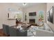 Cozy living room showcasing a stone fireplace, hardwood floors, and an open layout at 150 Northshore Xing, Dallas, GA 30157