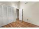 A light-filled bedroom featuring a large closet and wood flooring and accents at 20 Cheryl Ter, Covington, GA 30016
