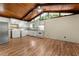 Bright kitchen with wood ceiling, modern appliances, washer and dryer hookups, and wood flooring at 20 Cheryl Ter, Covington, GA 30016
