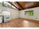 A bright kitchen with wood floors and accents, featuring white appliances and natural light at 20 Cheryl Ter, Covington, GA 30016