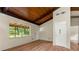 Bright living room featuring wood flooring, a large window, and a wood ceiling at 20 Cheryl Ter, Covington, GA 30016