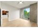 Bright bedroom featuring light wood floors, ceiling fan, and balcony view at 3300 Windy Ridge Se Pkwy # 809, Atlanta, GA 30339