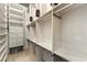 Walk-in closet with custom shelving, drawers, and ample storage space at 3300 Windy Ridge Se Pkwy # 809, Atlanta, GA 30339