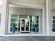 Inviting building entrance with glass doors, potted plants, and prominent signage for easy identification at 3300 Windy Ridge Se Pkwy # 809, Atlanta, GA 30339