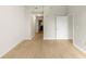Empty hallway with light walls, wood floors, and access to various rooms at 3300 Windy Ridge Se Pkwy # 809, Atlanta, GA 30339