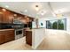 Modern kitchen features a breakfast bar, stainless appliances, and views from a wall of windows at 3300 Windy Ridge Se Pkwy # 809, Atlanta, GA 30339