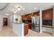 Bright kitchen with stainless steel appliances, wood cabinets, granite counters, and a breakfast bar, perfect for casual dining at 3300 Windy Ridge Se Pkwy # 809, Atlanta, GA 30339