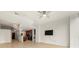 Open-concept living space features hard wood floors, a ceiling fan and mounted tv at 3300 Windy Ridge Se Pkwy # 809, Atlanta, GA 30339