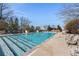 Large outdoor pool with plenty of lounge chairs and a clear blue sky at 3300 Windy Ridge Se Pkwy # 809, Atlanta, GA 30339