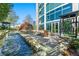 Exterior water feature by building featuring rock waterfall and patio with chairs and trees at 3300 Windy Ridge Se Pkwy # 809, Atlanta, GA 30339