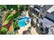 Luxury home aerial view showcases a sprawling backyard with a pool, patio, and manicured landscaping at 4745 Cuyahoga Cv, Suwanee, GA 30024