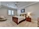 Cozy bedroom with a ceiling fan, natural light, and comfortable furnishings at 4745 Cuyahoga Cv, Suwanee, GA 30024