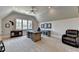 Large bonus room features a comfortable leather chair and a rustic wood desk at 4745 Cuyahoga Cv, Suwanee, GA 30024