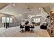 Expansive bonus room with seating areas, a desk, and plenty of natural light from multiple windows at 4745 Cuyahoga Cv, Suwanee, GA 30024
