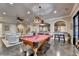 Game room with bar seating featuring a billiard table, cozy seating, and abundant natural light at 4745 Cuyahoga Cv, Suwanee, GA 30024