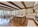 Open kitchen layout featuring a large center island, breakfast bar, and hardwood floors at 4745 Cuyahoga Cv, Suwanee, GA 30024