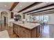 Kitchen featuring a large island, breakfast bar, and hardwood floors at 4745 Cuyahoga Cv, Suwanee, GA 30024