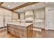 Beautiful kitchen with a center island, custom cabinets, and modern appliances at 4745 Cuyahoga Cv, Suwanee, GA 30024