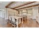 Spacious kitchen with a large island, custom cabinets, and ample counter space at 4745 Cuyahoga Cv, Suwanee, GA 30024