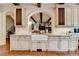 Beautiful kitchen featuring a farmhouse sink, granite counters, and custom cabinets at 4745 Cuyahoga Cv, Suwanee, GA 30024