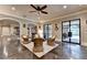 Open concept living room with seating and outside access to the pool at 4745 Cuyahoga Cv, Suwanee, GA 30024