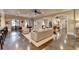 Spacious lower-level living area with multiple seating areas, bar, game room, and abundant natural light at 4745 Cuyahoga Cv, Suwanee, GA 30024